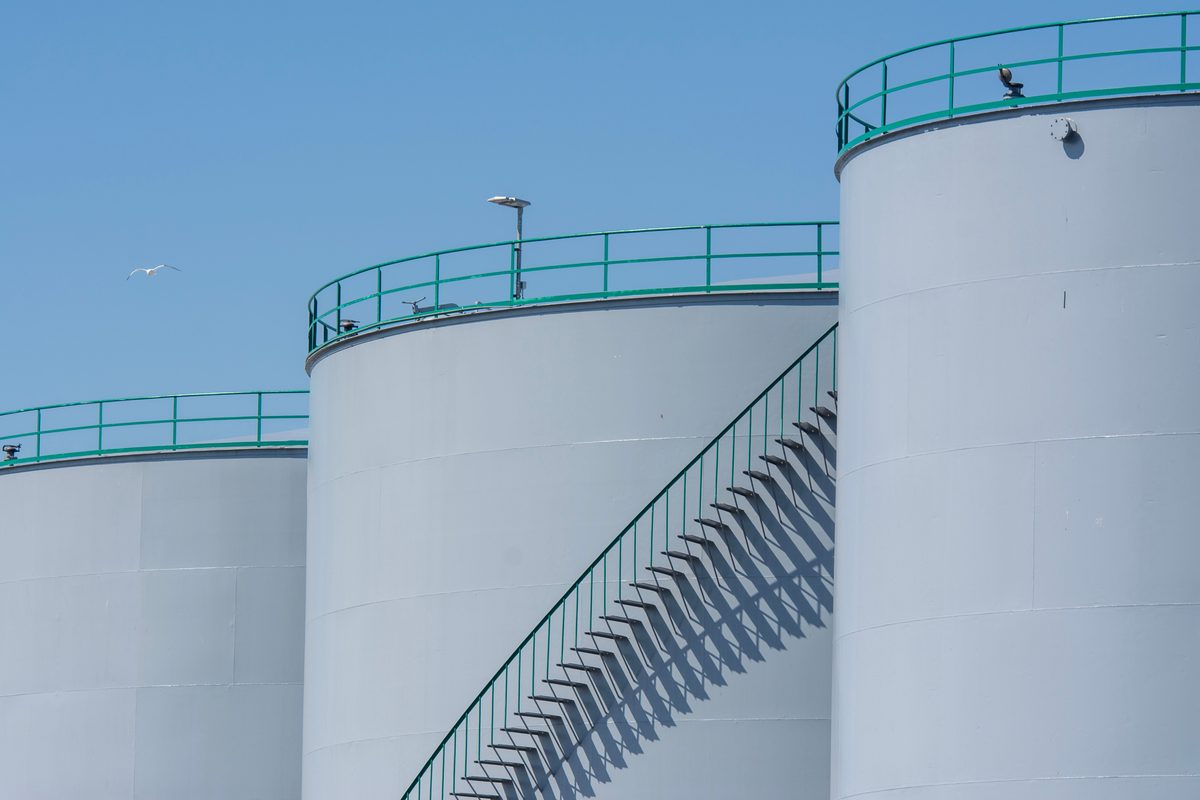 Aerial view of a coastal bulk liquid storage terminal beside the sea